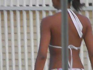 Sexy girl in a bikini walking by the pool Picture 8