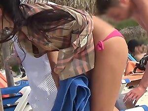 Sexy girl in pink bikini keeps dancing on the beach Picture 2