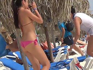 Sexy girl in pink bikini keeps dancing on the beach Picture 5