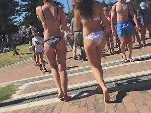 Fancy girl in white bikini walking by the beach Picture 1