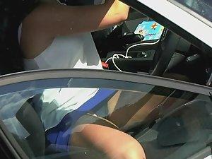 Black thong seen when milf sits in car Picture 2
