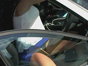 Black thong seen when milf sits in car Picture 4