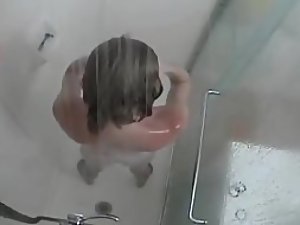 My guest caught showering and shaving the pussy on spy cam