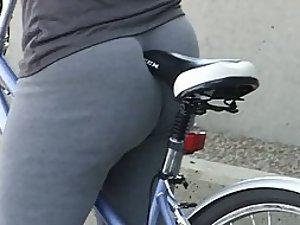 Bicycle seat pokes her gorgeous butt