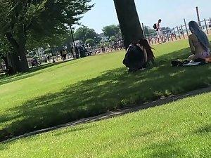 Peeping on punk girl's tattooed ass in park Picture 2