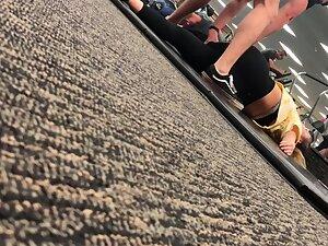 Fit girl stretching on the gym floor Picture 2