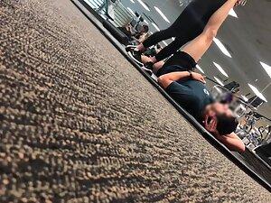 Fit girl stretching on the gym floor Picture 4