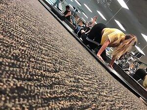 Fit girl stretching on the gym floor Picture 7