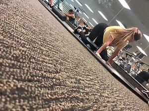 Fit girl stretching on the gym floor Picture 8