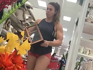 Gorgeous bodybuilder woman in the store