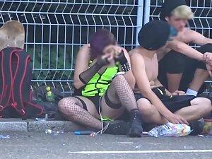 Two party girls sitting on the road curb with their legs spread Picture 5