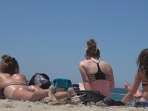 Teens bending over in front of me on beach Picture 4