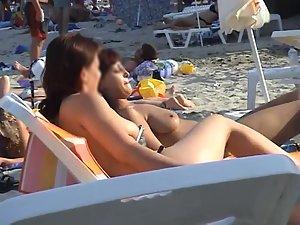 Topless girl friends at a beach Picture 8