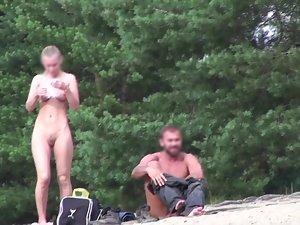 Voyeur zooms on young nudist couple Picture 2