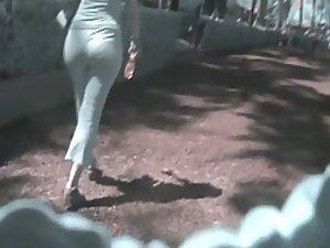 Little sexy ass in white pants got followed Picture 1