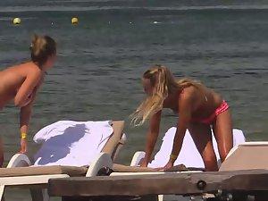 Topless girls relaxing by the beach Picture 3