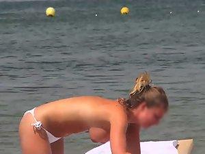 Topless girls relaxing by the beach Picture 4