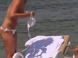 Topless girls relaxing by the beach Picture 5