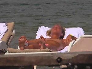 Topless girls relaxing by the beach Picture 7