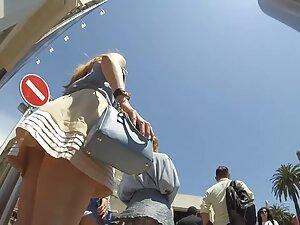 Wind shows upskirts of three asses to the candid camera Picture 1