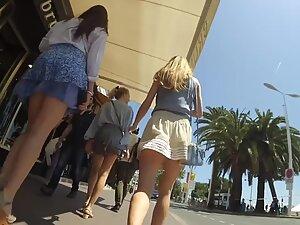 Wind shows upskirts of three asses to the candid camera Picture 3