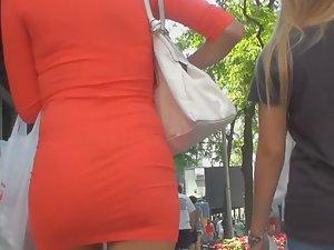 Perfect body of tourist girl in tight red dress Picture 3