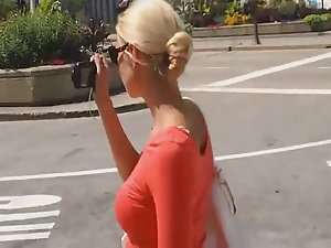 Perfect body of tourist girl in tight red dress