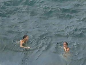Nudist girls swimming and having fun in water Picture 5