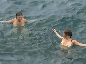 Nudist girls swimming and having fun in water Picture 6