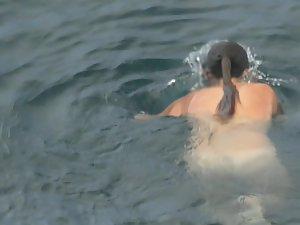 Nudist girls swimming and having fun in water Picture 7