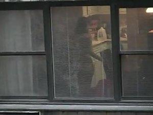 Topless neighbor girl in a window peep Picture 2
