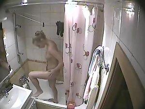 Young blonde girl caught in a shower Picture 5