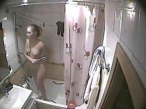 Young blonde girl caught in a shower Picture 7