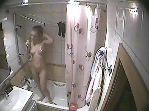 Young blonde girl caught in a shower Picture 8