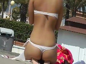 Adorable teenage ass in a thong bikini Picture 1