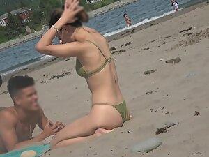 Thong bikini shows her round ass and yummy cameltoe Picture 1