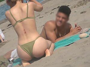 Thong bikini shows her round ass and yummy cameltoe Picture 7