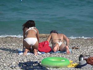 Inspection of two teen friends in big white bikinis Picture 3