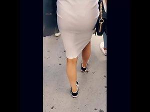 Tight white dress reveals tight buttocks and thong Picture 1