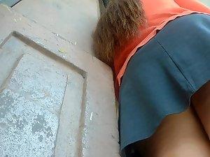 Chunky ass exposed in upskirt by the wall Picture 8