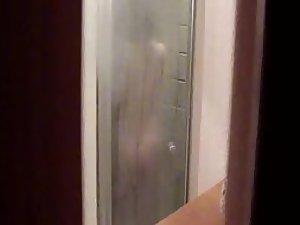 Girl shaves her pussy in the shower