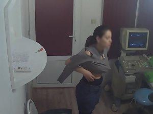 Shy woman removes clothes in doctor's office Picture 2