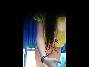 Mesmerizing hairless pussy caught by voyeur in beach cabin Picture 2