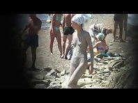 Muddy naked girl on a crowded beach Picture 8
