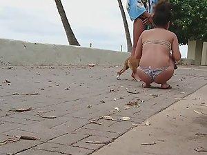Hot girls play with dog by the beach Picture 2