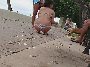 Hot girls play with dog by the beach Picture 3