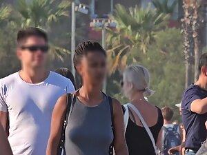 Black girl's tits are poking through her shirt