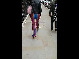 Voyeur follows a big butt in rainbow pants Picture 1