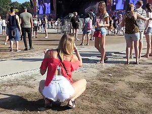 Sexy friends in shorts on a music festival