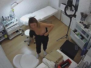 Spying on beautician changing clothes in her beauty salon Picture 1